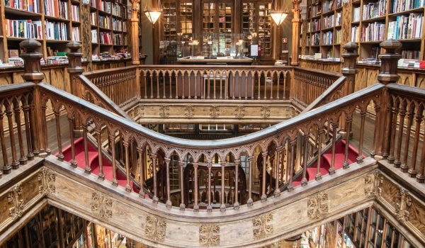 Photograph of a library with an elaborate staircase